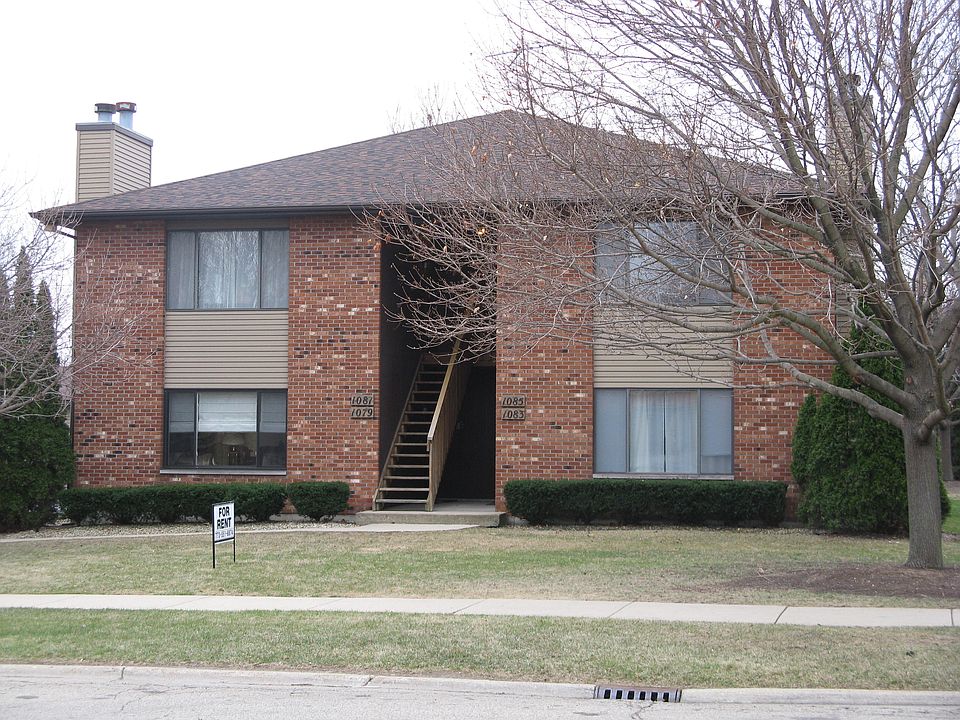 Attractive brick exterior with mature landscaping and ample parking