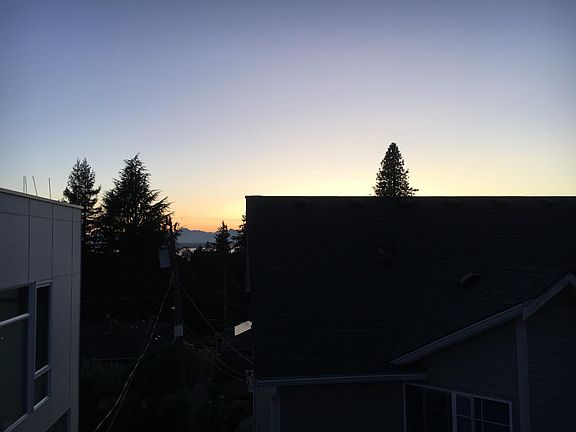 More rooftop sunset. The Olympic mountains are visible over Puget Sound.