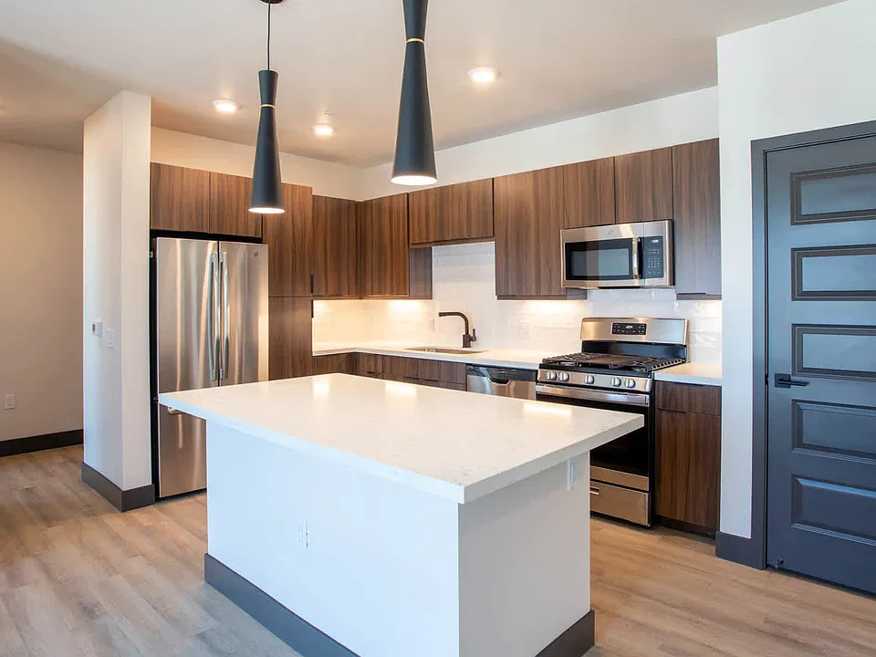 Kitchen with Breakfast Bar and Stainless Steel Appliances