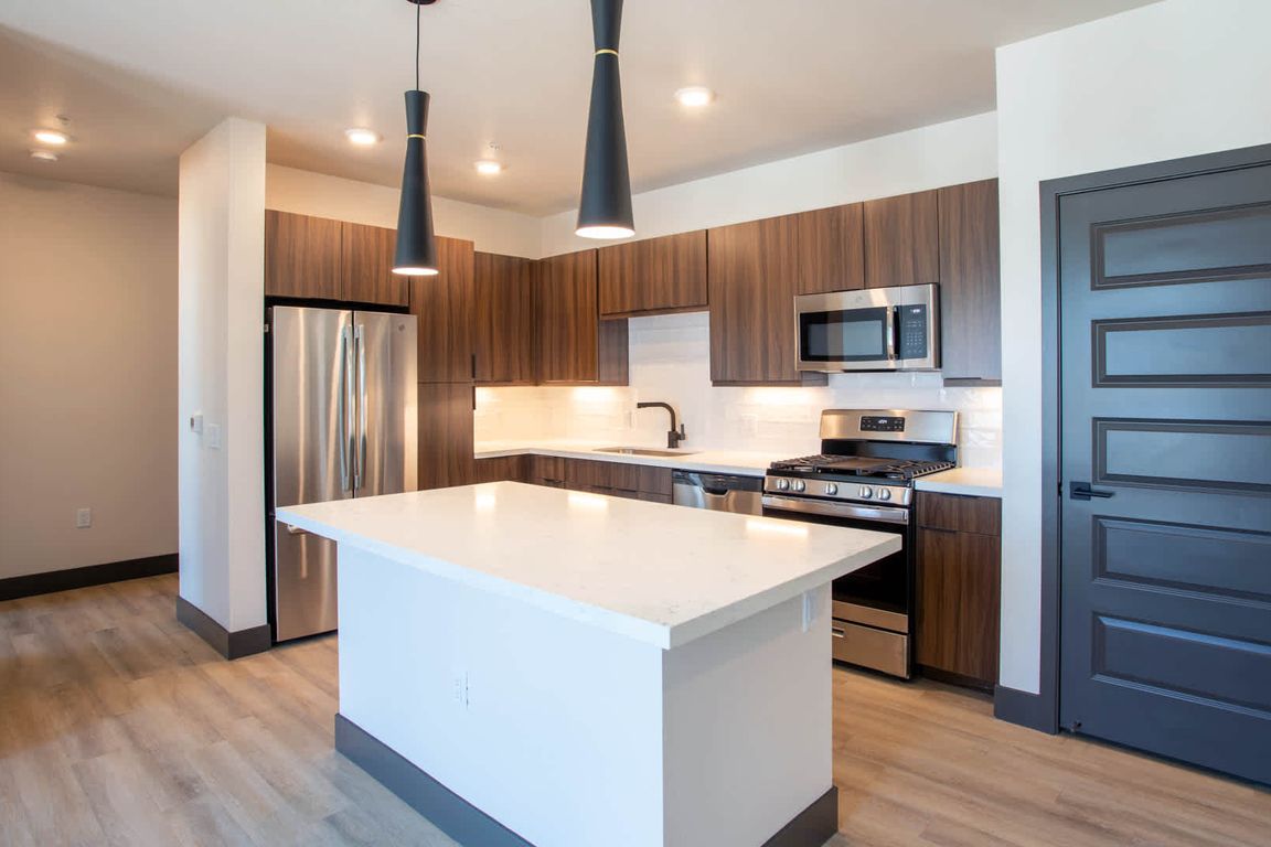 Kitchen with Breakfast Bar and Stainless Steel Appliances