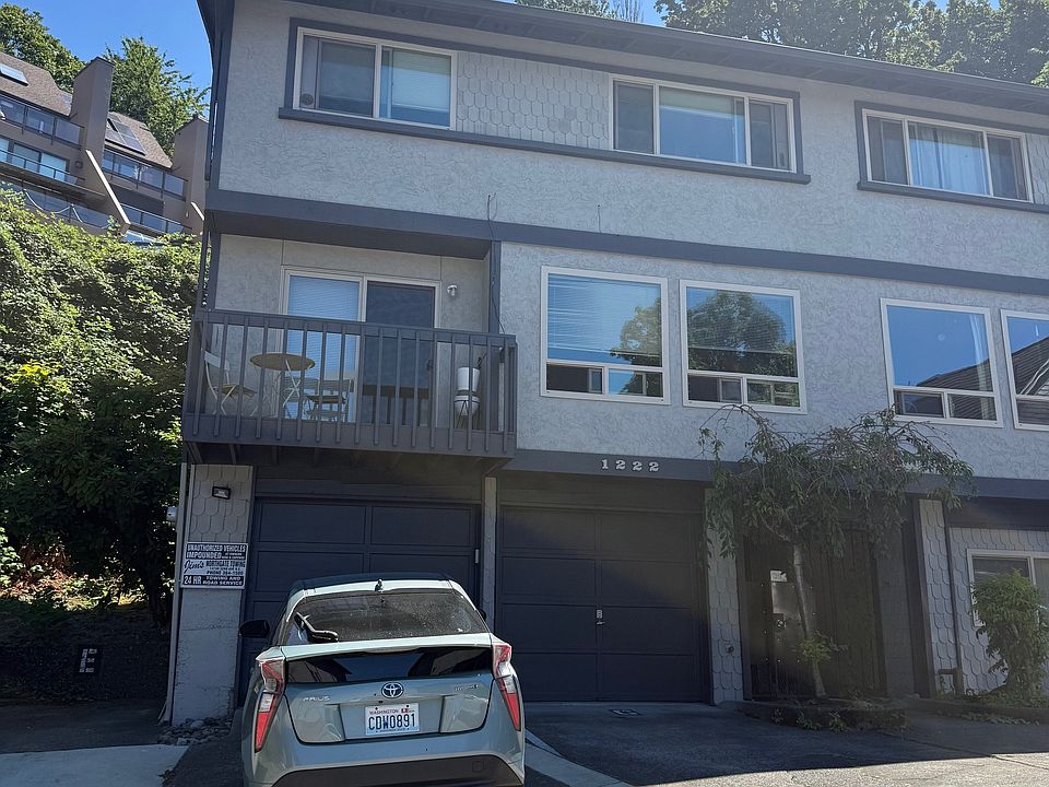 1222 Lakeview Blvd. East - from top of driveway. Apartment is top two floors on left side of buidling - above parked car.