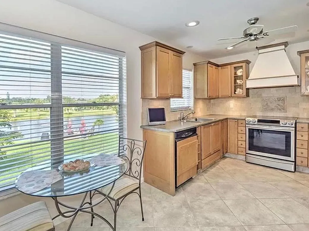 Fully equipped kitchen with all standard appliances, dishwasher, convection oven, air fryer, broiler oven, dishes, pots and pans and silverware. - 6864 Sandtrap Dr #3