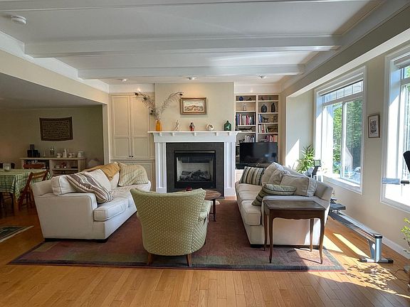 Living room with large east-facing windows.