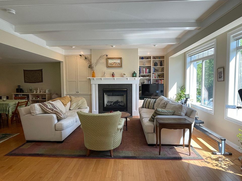 Living room with large east-facing windows.