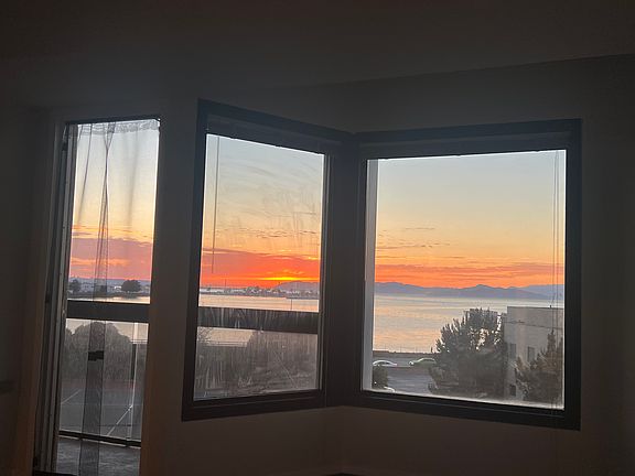 Beautiful sunset view from the bedroom. Bug net included for when you want to keep the door open to the patio.