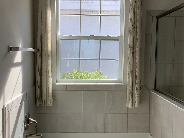 "Relaxing soaking tub in primary bathroom"