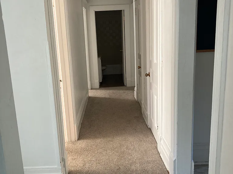 hallway to 3 bedrooms and bathroom
