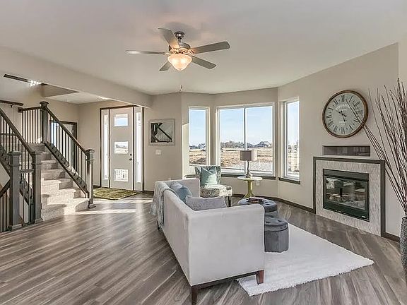living area with gas fireplace, lots of windows.