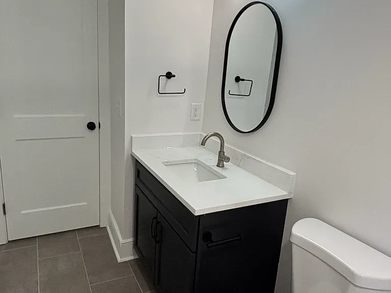 Vanity with quartz countertop.