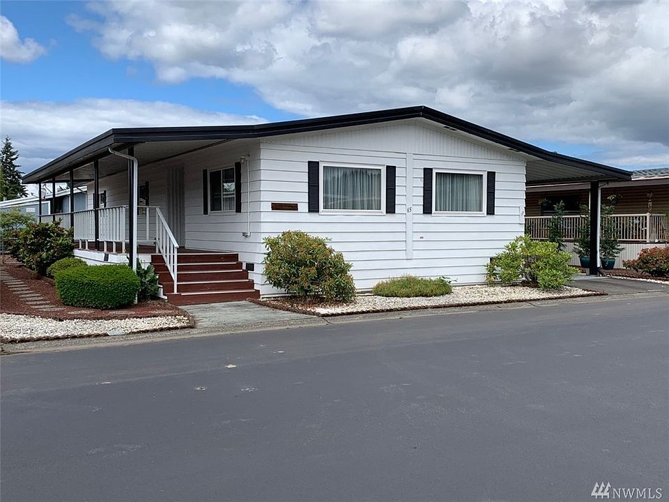 Over 1300 square foot home with a large covered porch, carport, nice size lot and storage shed.