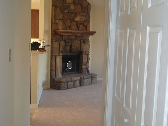 Looking into great room with laundry closet to the right washer & dryer stay