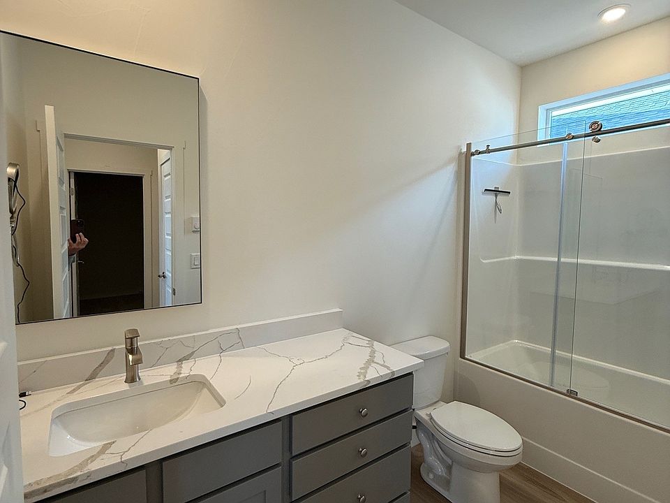 Shower has a glass enclosure