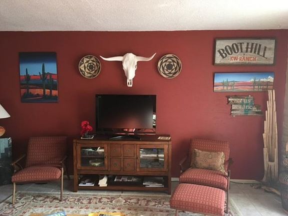 Spacious and comfortable living room with high end furnishings and decor.