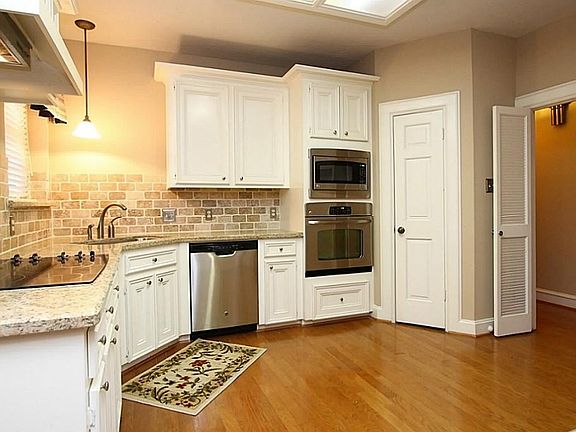 Another view of the kitchen showing plenty of counter and cabinet space.