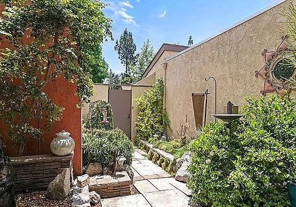 Enjoy this private front courtyard that greets you home everyday.