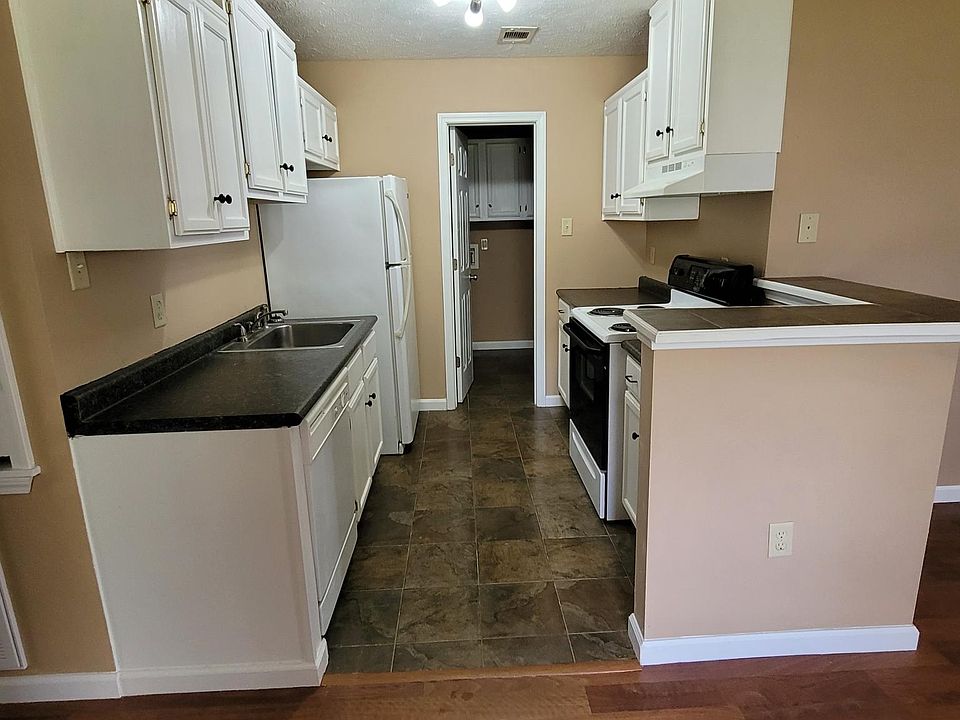 Kitchen - Leads into the laundry and garage areas.