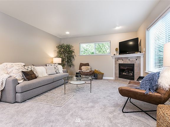 Open living room with gas fireplace.