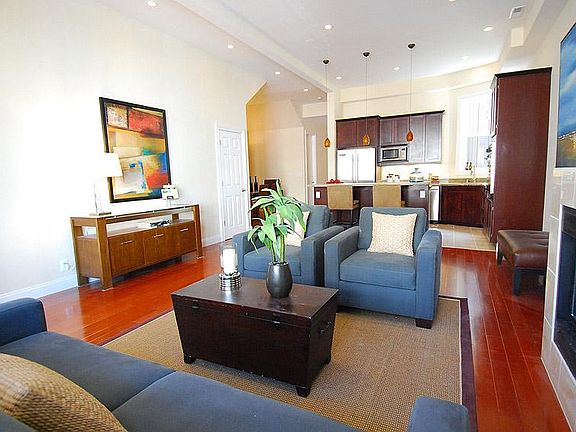 14 foot ceilings throughout condo! Single level great room! Huge Bay window! Gas fireplace! Viking Appliances, 6 burner stove, purified water & hot water dispenser. Huge closet size pantry, and seperate laundry closet in hallway. That door you see