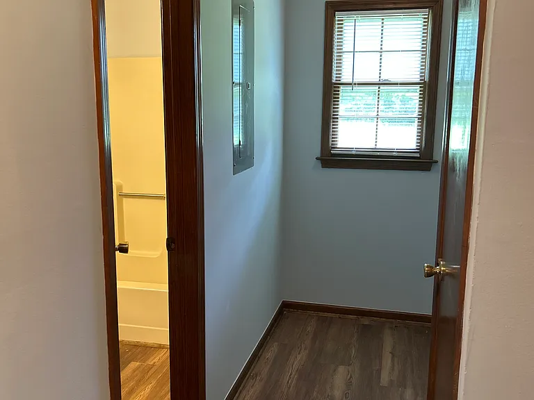 Hallway to laundry area, second bathroom and 2 closets