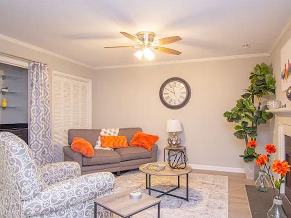 Spacious living room featuring a built-in wet bar_perfect for entertaining or relaxing at home.