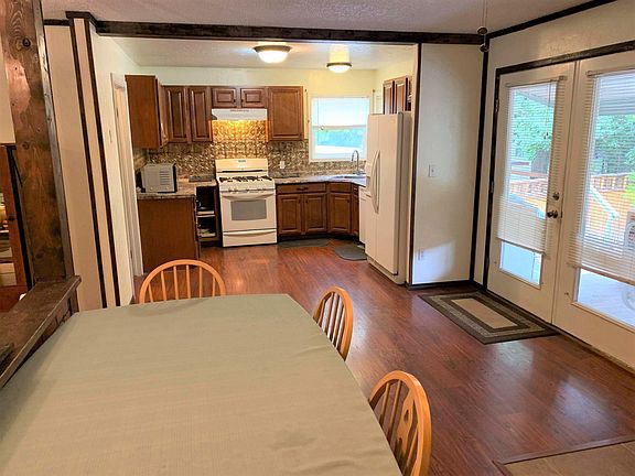 Dining room and kitchen with open floor plan.