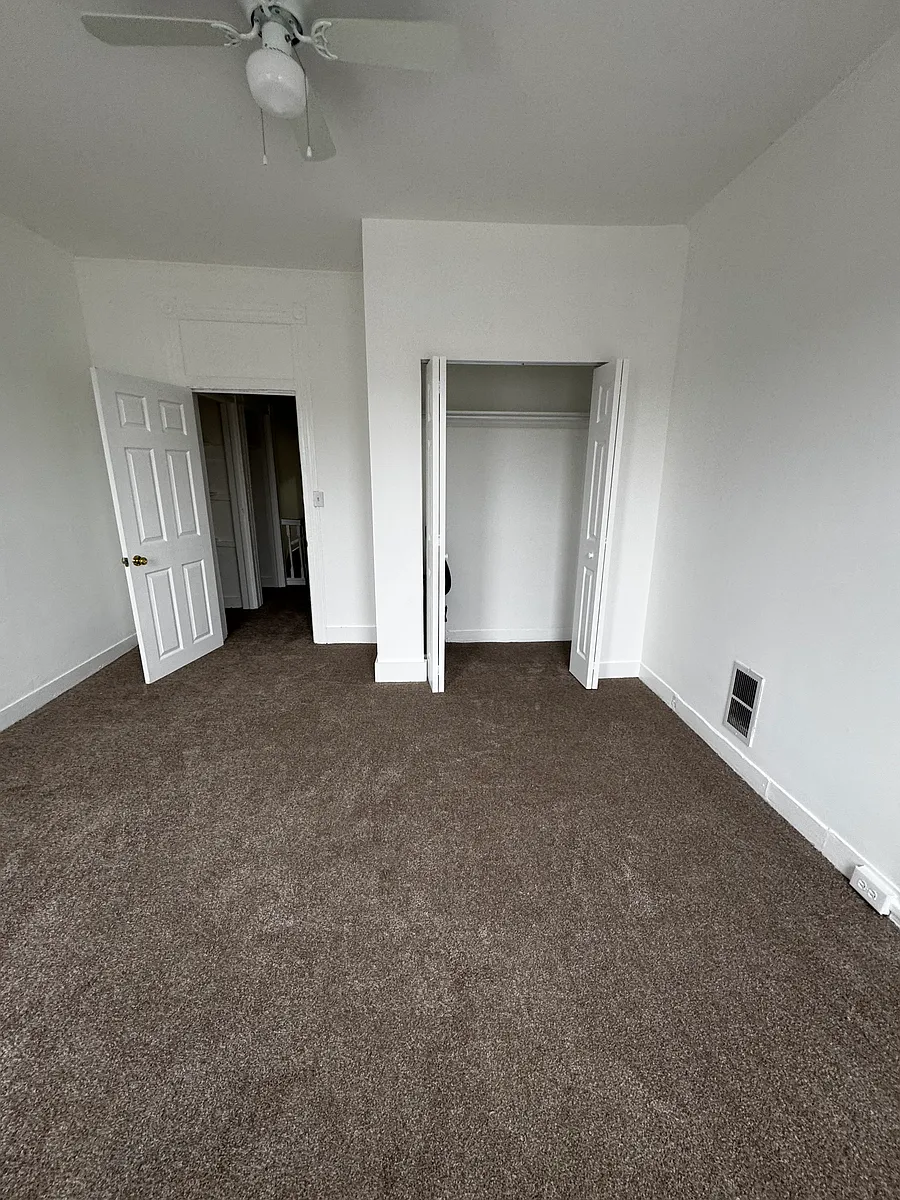 1st bedroom is 14 x 14ft. Vantage point it from the window. Fits a king size bed set. - 3421 E Baltimore St #1