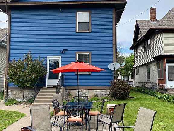 Spacious backyard with patio and dining set