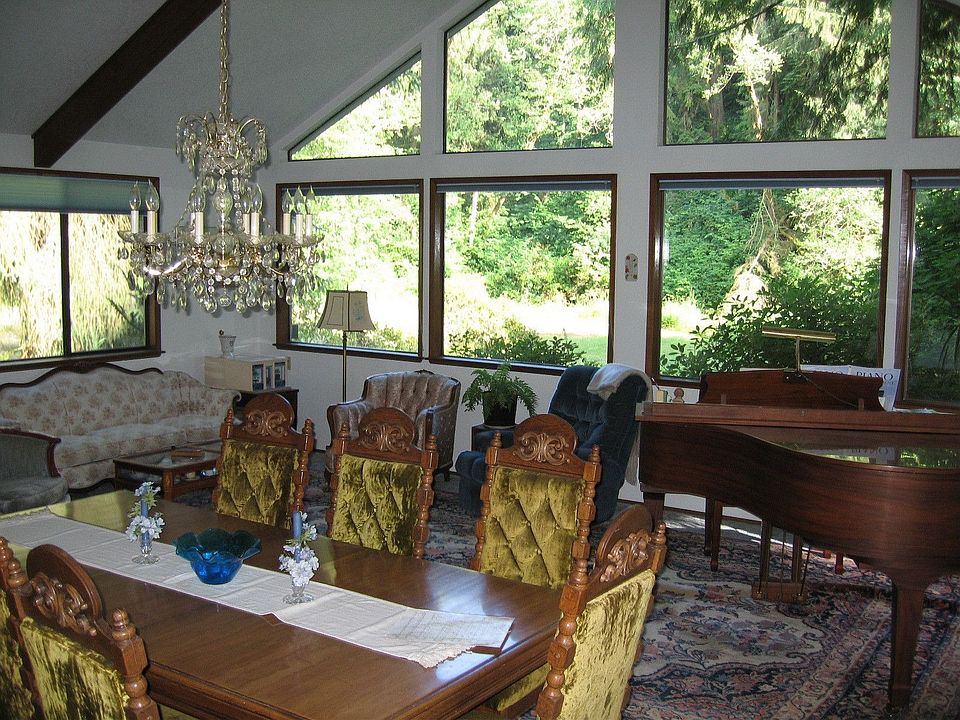 Beautiful large windows in the living room  that overlook the creek