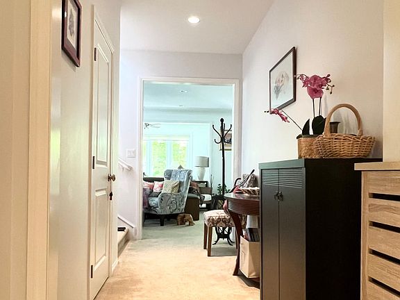 Entry to home from front door. Downstairs bedroom and bathroom with shower to the left of the front door on first level