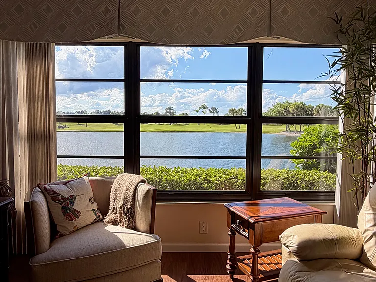 Enjoy STUNNING lake & golf course views from the living room!