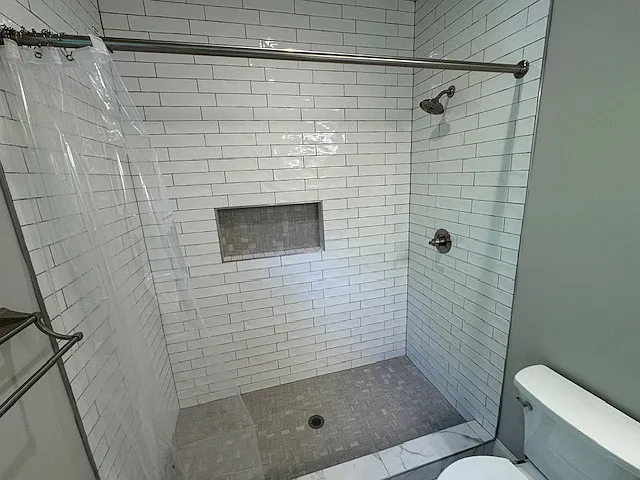 Extra Large Primary Shower with Floor to Ceiling tile and large tiled Niche
