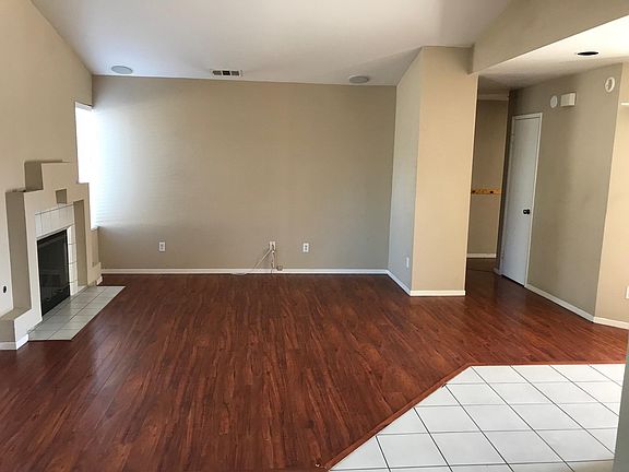 View from kitchen looking into living room and hallway leading to bedrooms.