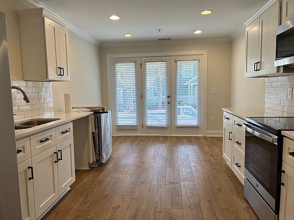 Kitchen with new appliances, quartz counter top, and subway tile backsplash (dishwasher was waiting to be installed)
