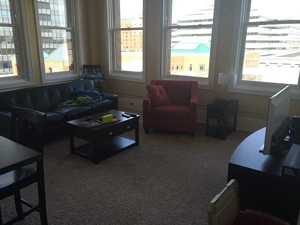 Open Living room with wall spanning windows