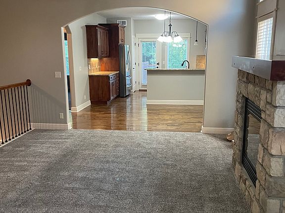 From the entry, you enter into the living room. You can see into the dining room and kitchen.