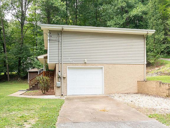 Private driveway featuring one-car garage and parking for 2-3 vehicles.
