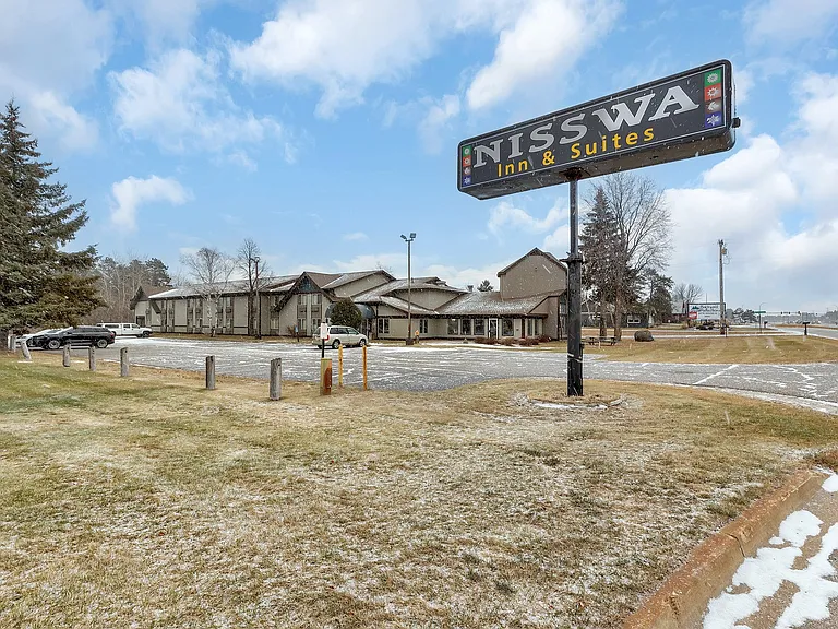 Nisswa Hotel & Suites sign visible from Hwy 371.