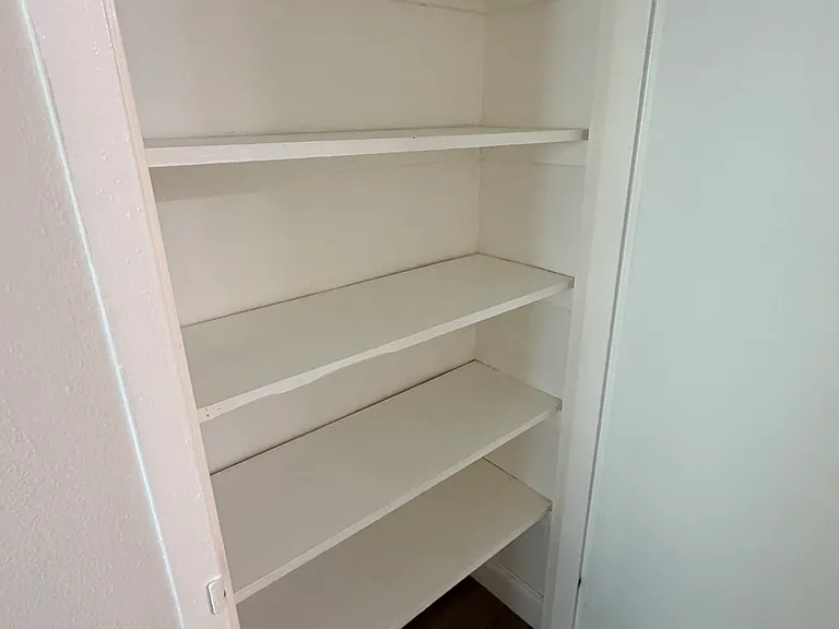 Hallway closet (across from bathroom)
