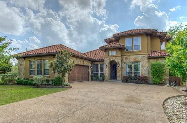 Magnificent two-story custom stone home in Hills of Lakeway.