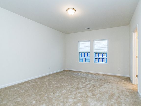 The primary suite offers a large walk-in closet.