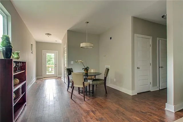 Lots of great storage- just off the kitchen, you'll find a walk in pantry, 1/2 bath, and large storage closet and just past the dining area is a large laundry room with W&D included.
