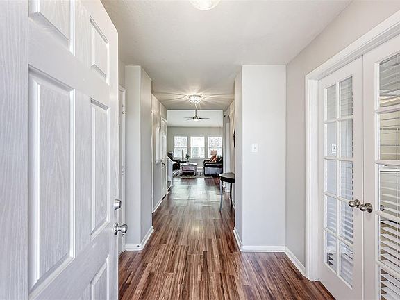 Clean and freshly painted, this is the view from the front door to the family room in the back of the home. This home offers a great floor plan!