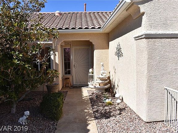 Fenced Courtyard with Security Front Door Screen, Fountain Will Remain with Property