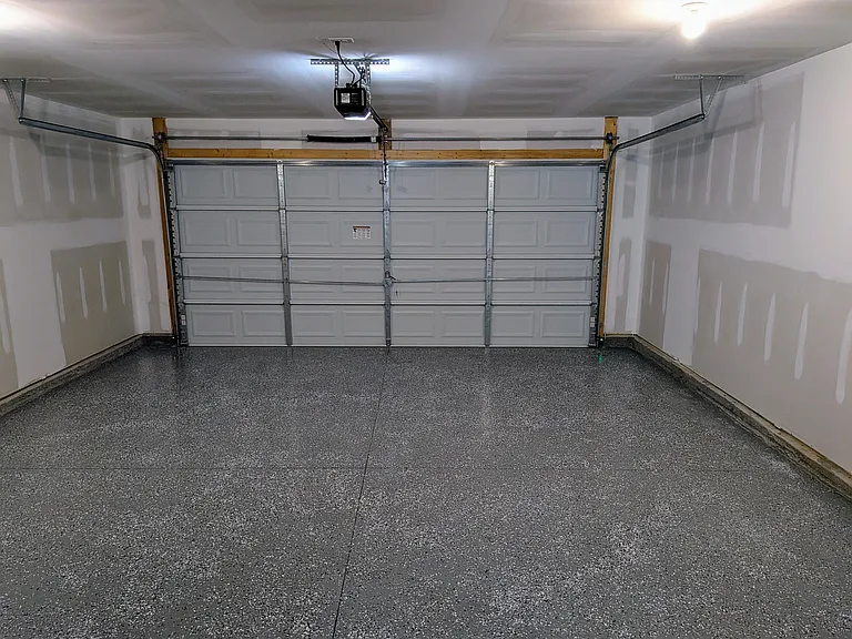 Spacious 2-car garage equipped with an automatic garage door opener for easy access and everyday convenience.