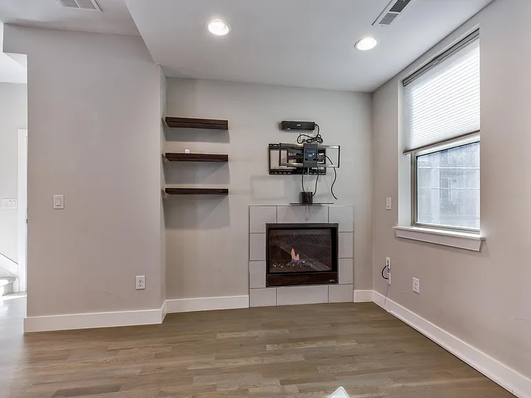 Living room w/ electric fireplace