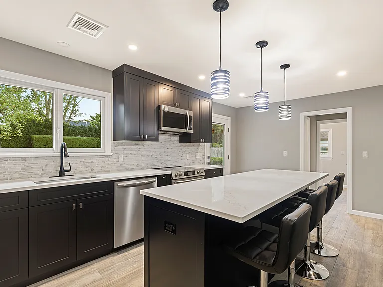kitchen with large island and granite counter tops