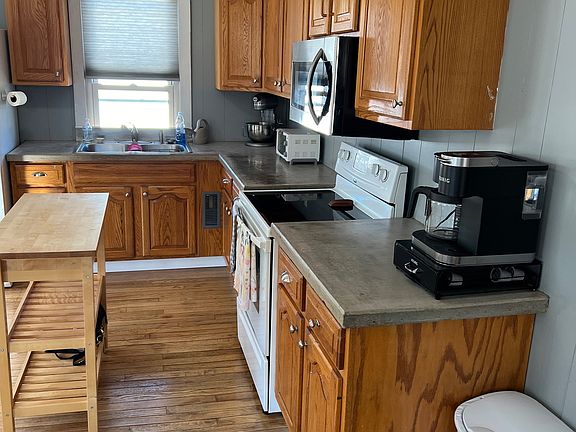 Concrete countertops, glass top stove.
