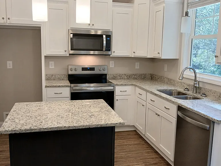 Granite counters and island. See new fridge shown in separate picture!