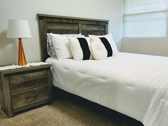 Second Bedroom With Queen Bed, Dresser, Nightstand, Closet, Smart TV.