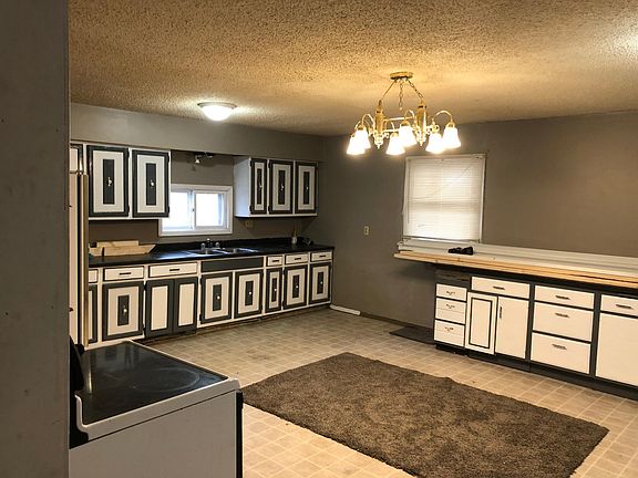 Large kitchen with stove and refrigerator
